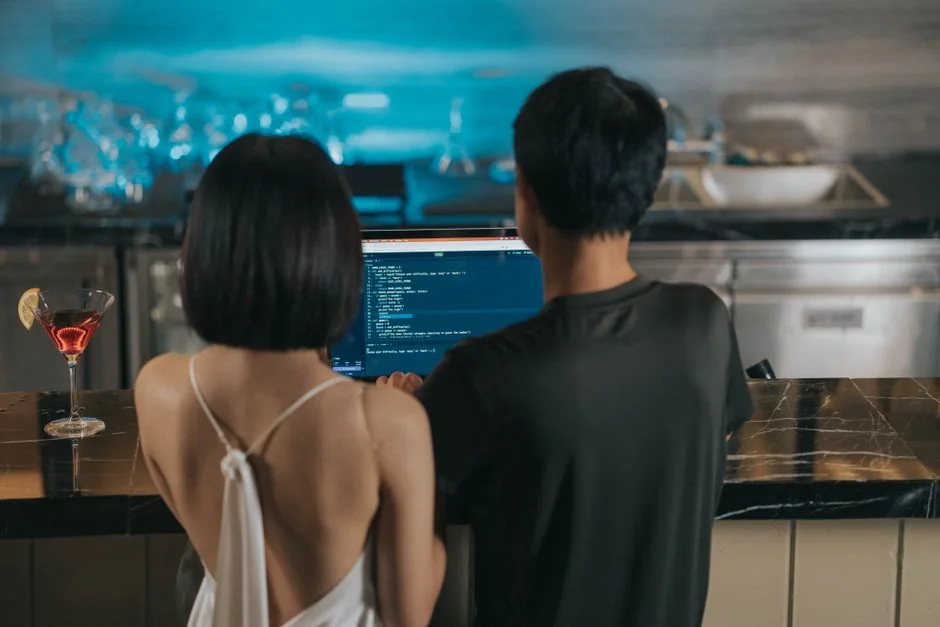 Stylish and efficient workspace with multiple monitors, laptop, and smartphone, showcasing a web design project.